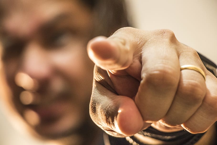 A man pointing at someone which is not polite in thailand.