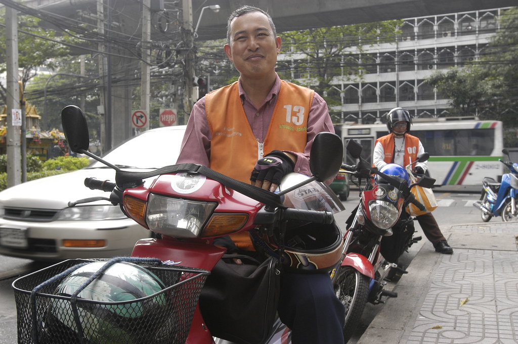 A motorcycle taxi driver in Thailand.