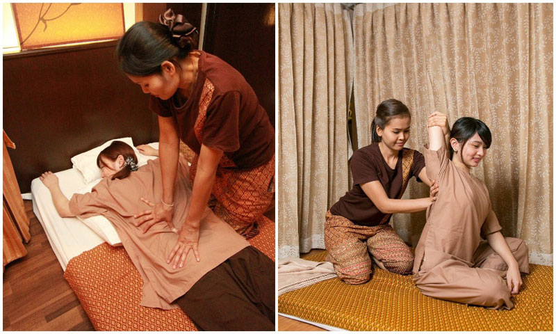 A Thai masseuse giving a Thai massage