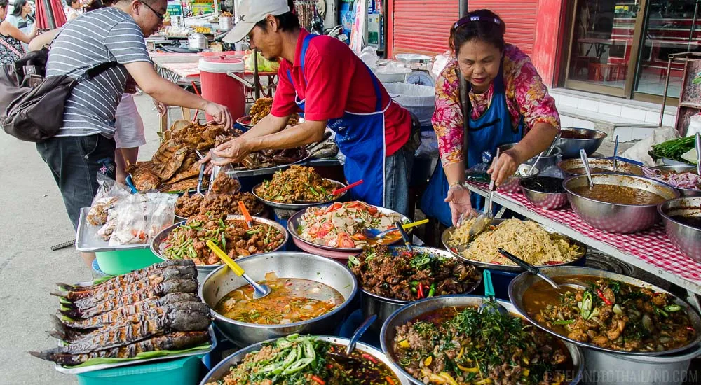 A street food market in Thailand showing a variety of Thai foods