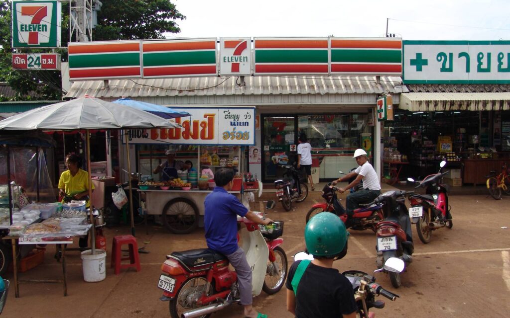 7/11 in Thailand with street food in front.