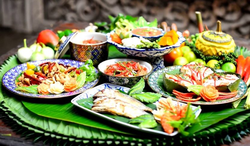 A spread of Thai food including fish.