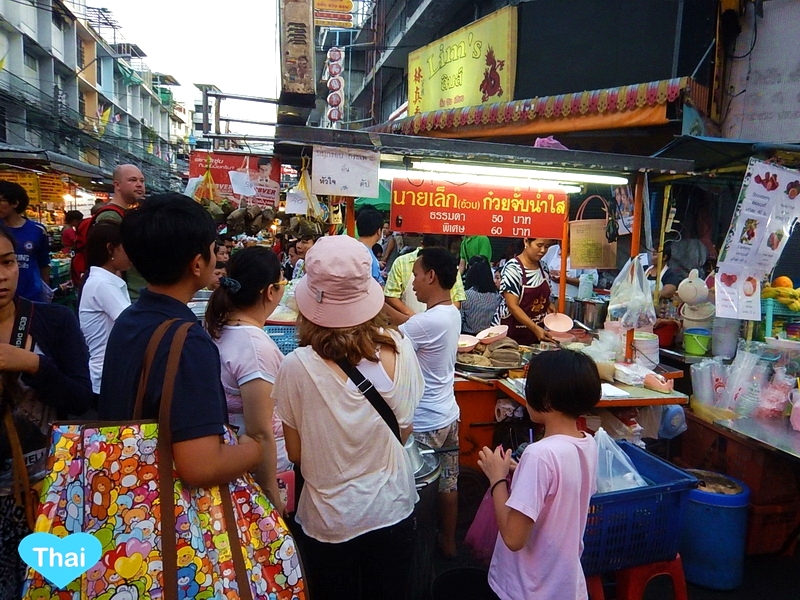 A crowded street vendor in thailand.