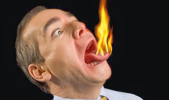 A man with fire on his tongue after eating spicy thai food.